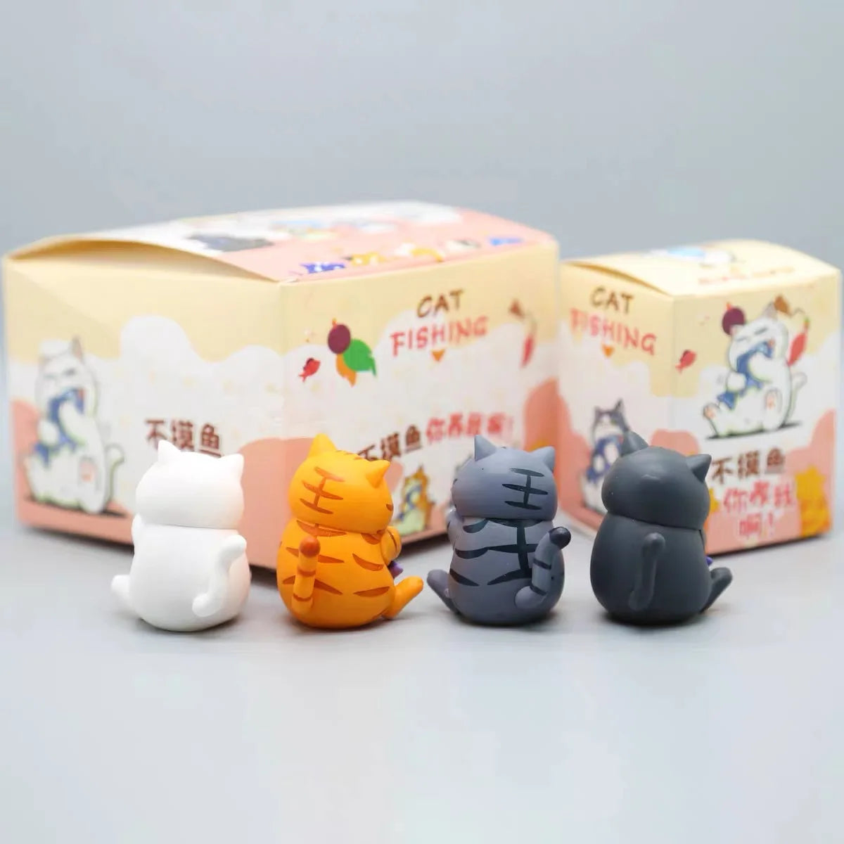 Chubby Cat Holding Fish Blind Box Figure